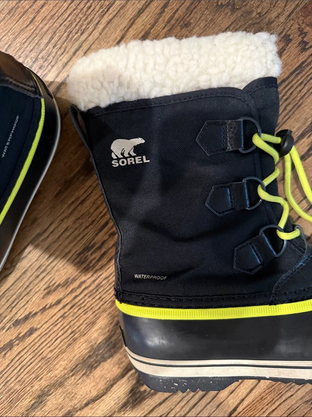 Sorel Kids Yoot Blk nylon boots with Neon Yellow Accents and Cream Faux Fur